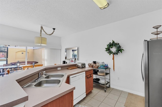 kitchen with dishwasher, stainless steel fridge, plenty of natural light, and pendant lighting