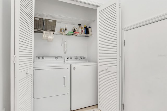 washroom featuring washer and dryer