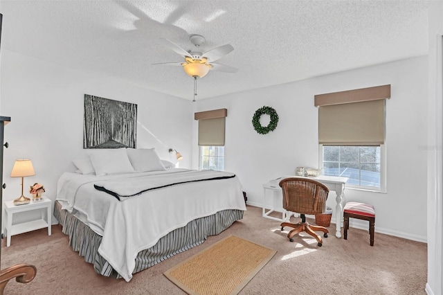 carpeted bedroom with a textured ceiling and ceiling fan