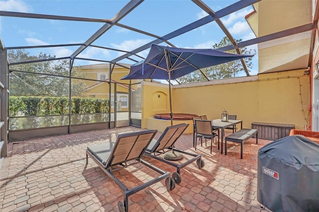 view of patio featuring a lanai and grilling area