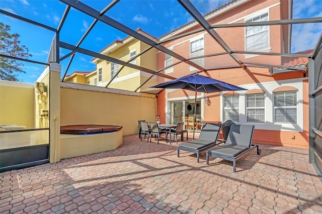 view of patio / terrace with glass enclosure