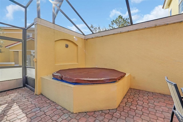 view of patio / terrace with a hot tub