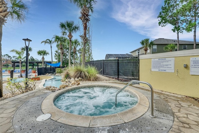 view of pool with a community hot tub