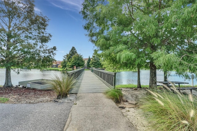 surrounding community featuring a water view