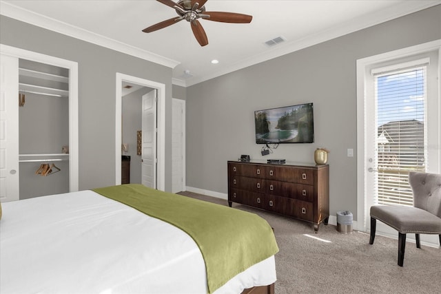 carpeted bedroom featuring multiple windows, ceiling fan, and crown molding