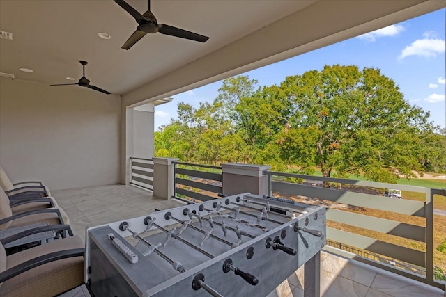 view of patio / terrace featuring a balcony and ceiling fan