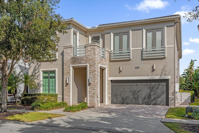 view of front of house with a balcony and a garage