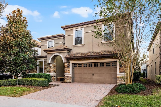 mediterranean / spanish-style house featuring a garage