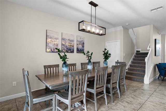 dining space with light tile patterned flooring