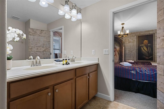 bathroom featuring tile patterned flooring and vanity