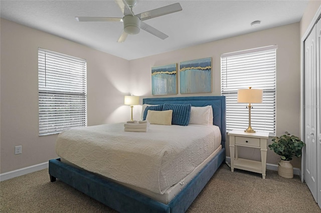 bedroom featuring ceiling fan, a closet, and carpet