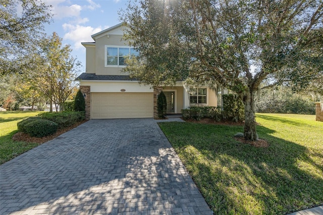 view of front of house with a garage and a front lawn