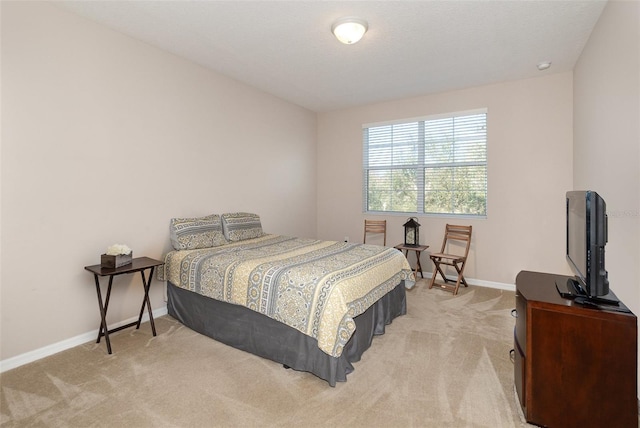 bedroom featuring light colored carpet