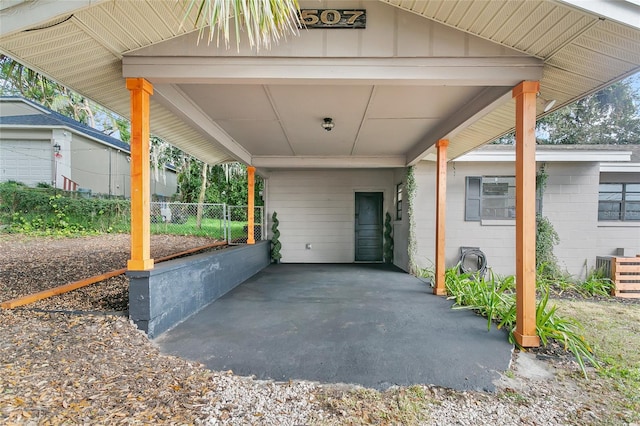 view of patio / terrace featuring central AC unit and a carport