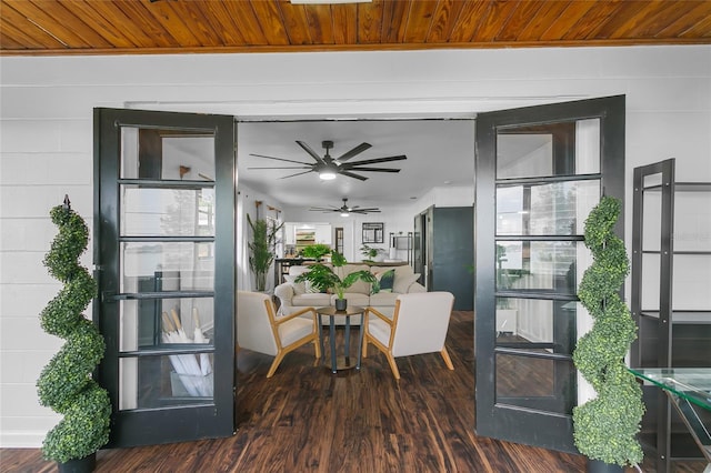 interior space featuring wooden ceiling, ceiling fan, and dark wood-type flooring