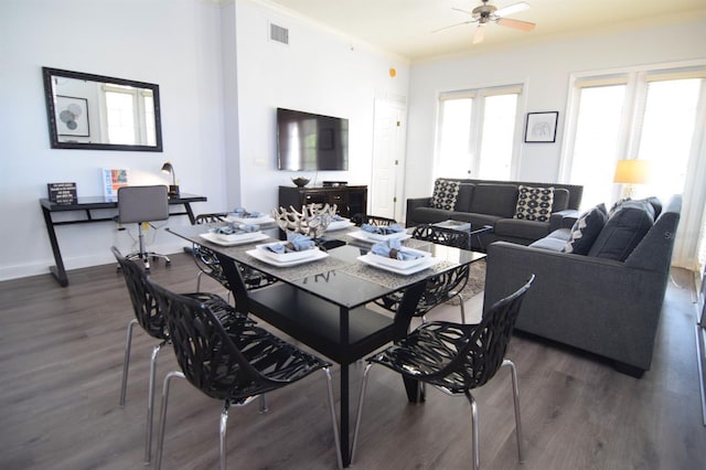 dining room featuring french doors, dark wood-type flooring, ceiling fan, and ornamental molding