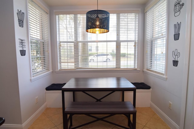 dining area featuring a healthy amount of sunlight and light tile patterned flooring