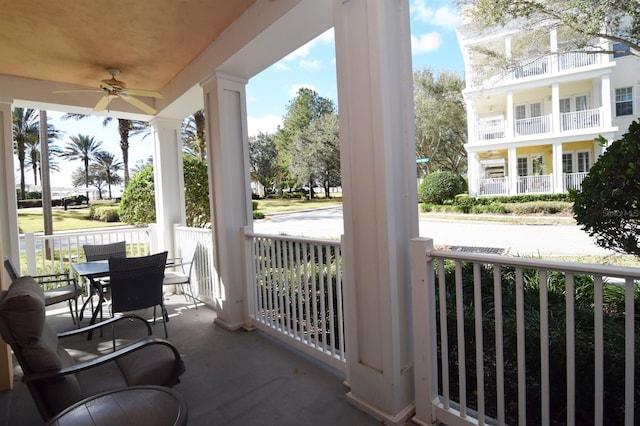 view of patio featuring ceiling fan and a porch