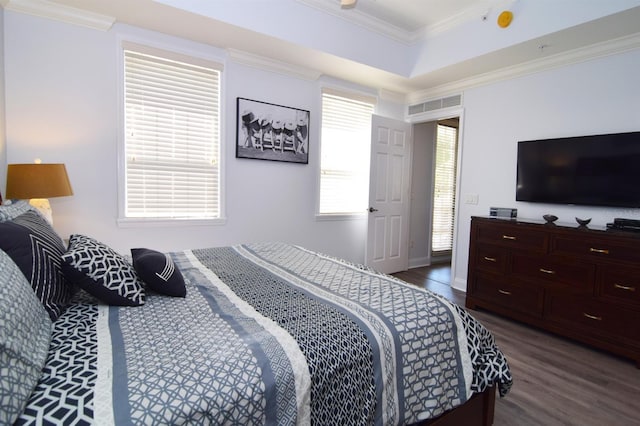 bedroom featuring dark hardwood / wood-style flooring and ornamental molding