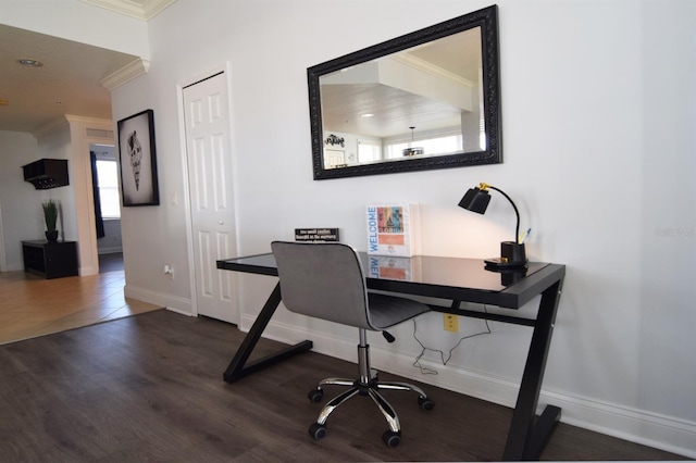 home office with dark hardwood / wood-style floors and ornamental molding