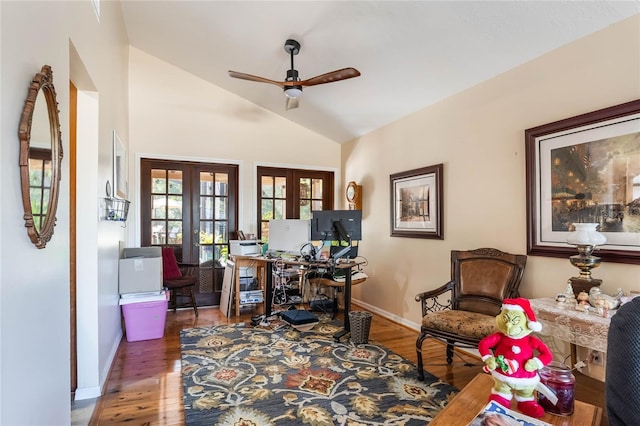 home office featuring dark hardwood / wood-style flooring, ceiling fan, french doors, and vaulted ceiling