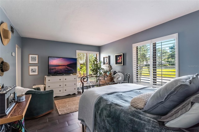 bedroom featuring multiple windows