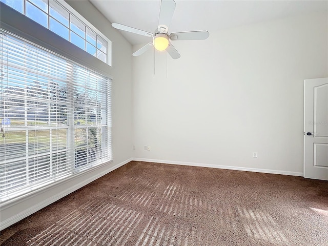 spare room with ceiling fan and carpet floors