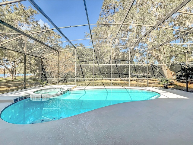 view of pool with an in ground hot tub and glass enclosure