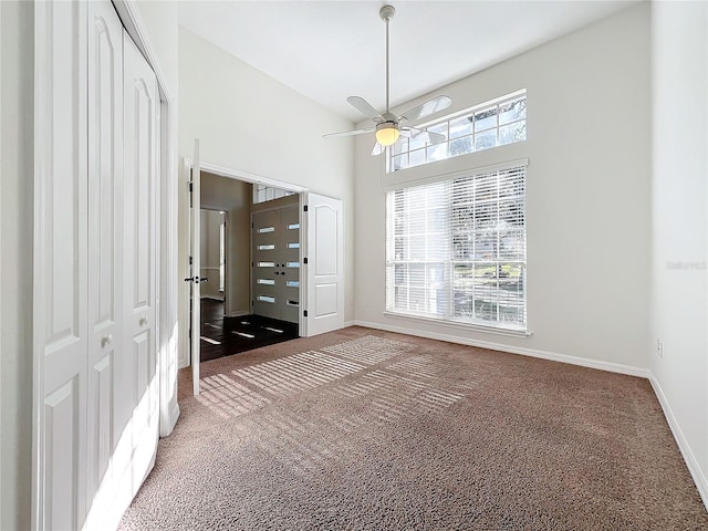 interior space with high vaulted ceiling and ceiling fan