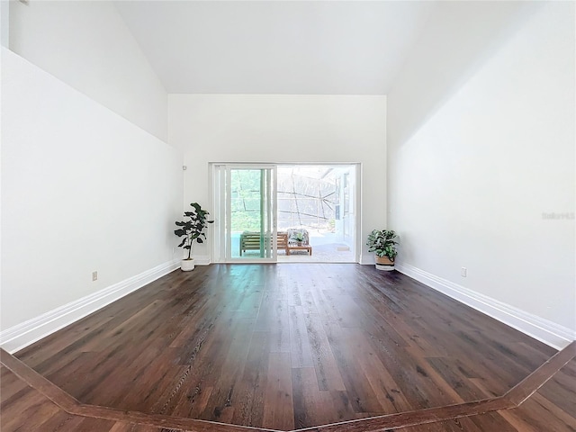 unfurnished living room featuring dark hardwood / wood-style flooring