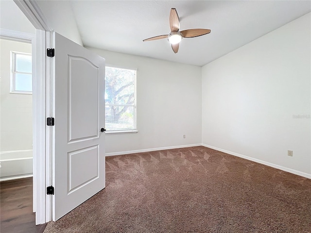 carpeted spare room with ceiling fan