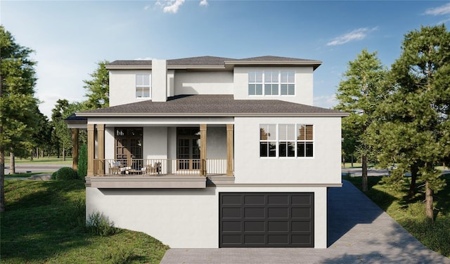 view of front of property featuring a garage and a front yard