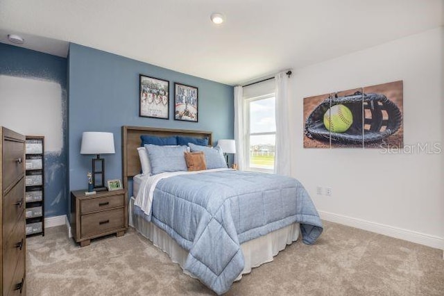 bedroom featuring light carpet