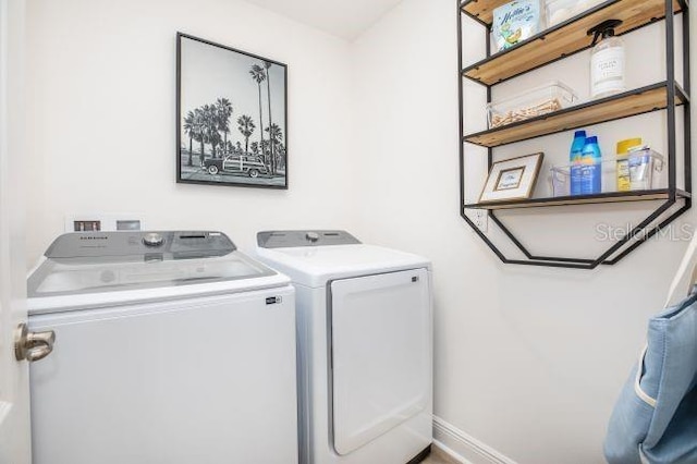 washroom featuring washing machine and dryer