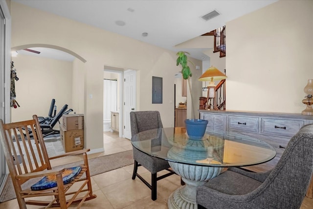 dining area featuring light tile patterned floors and electric panel