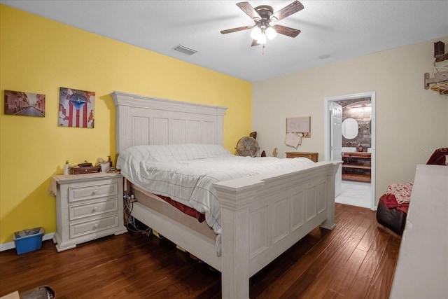 bedroom with dark hardwood / wood-style floors, ceiling fan, and ensuite bathroom