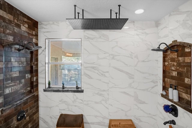 bathroom featuring a textured ceiling and walk in shower