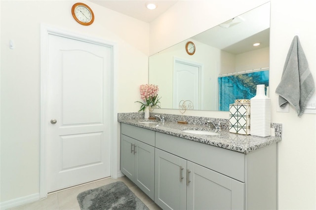 bathroom featuring tile patterned flooring and vanity