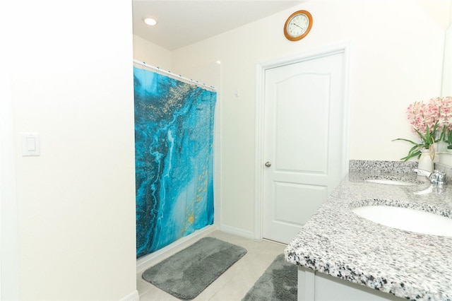 bathroom with a shower with curtain, tile patterned flooring, and vanity