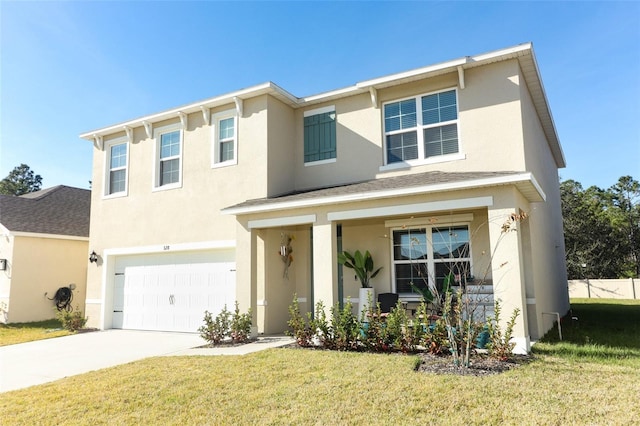 view of front facade with a garage and a front lawn