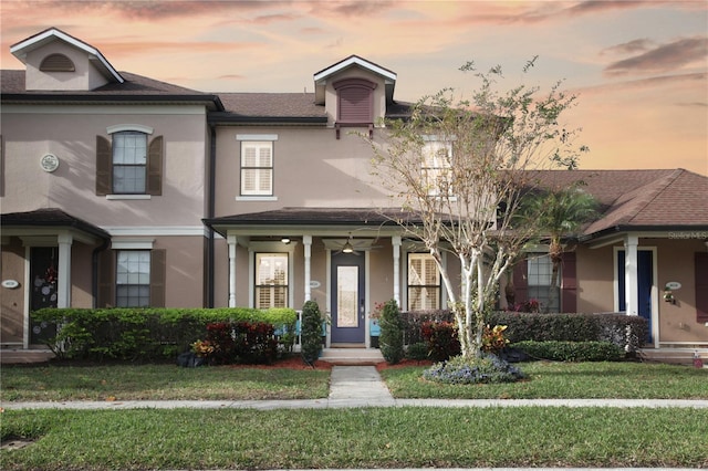 view of front of property with a lawn