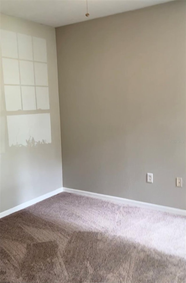 unfurnished room with carpet flooring