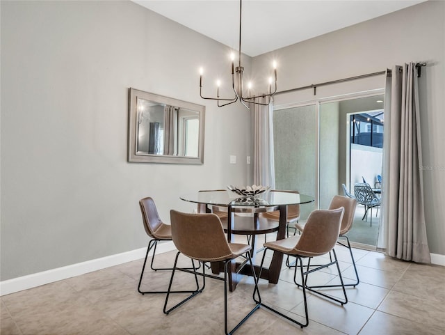 dining room featuring a chandelier and light tile patterned flooring