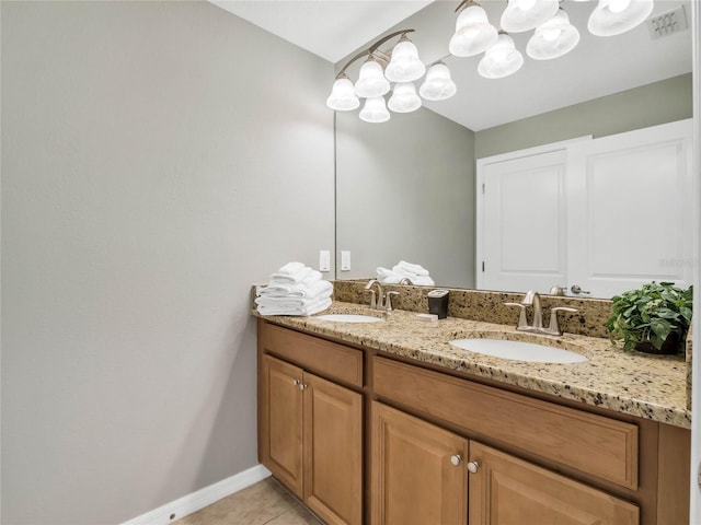 bathroom with tile patterned floors and vanity