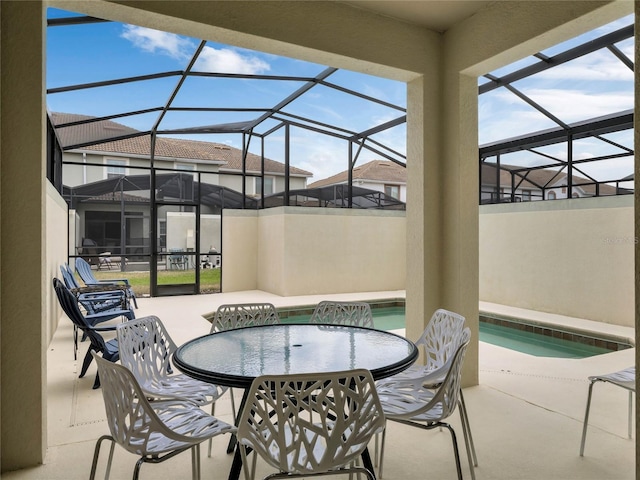 view of patio / terrace with a lanai