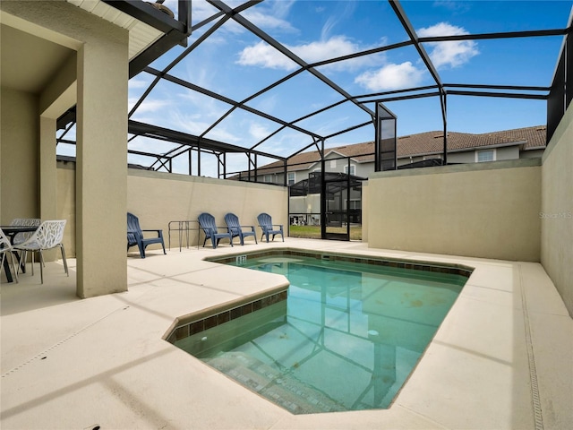 view of pool featuring a patio and a lanai