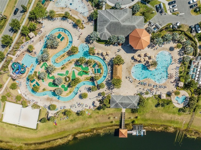 birds eye view of property with a water view