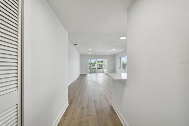 hall with light hardwood / wood-style floors