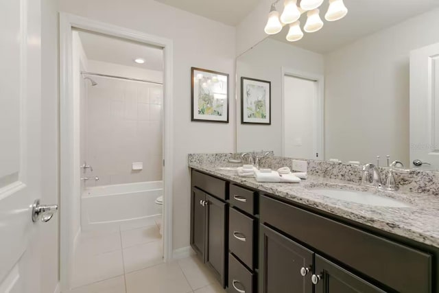 bathroom featuring tile patterned floors, vanity, and tiled shower / bath