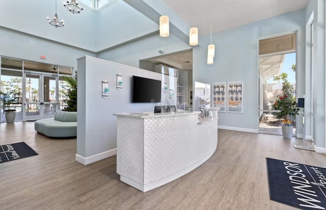 reception featuring an inviting chandelier and french doors